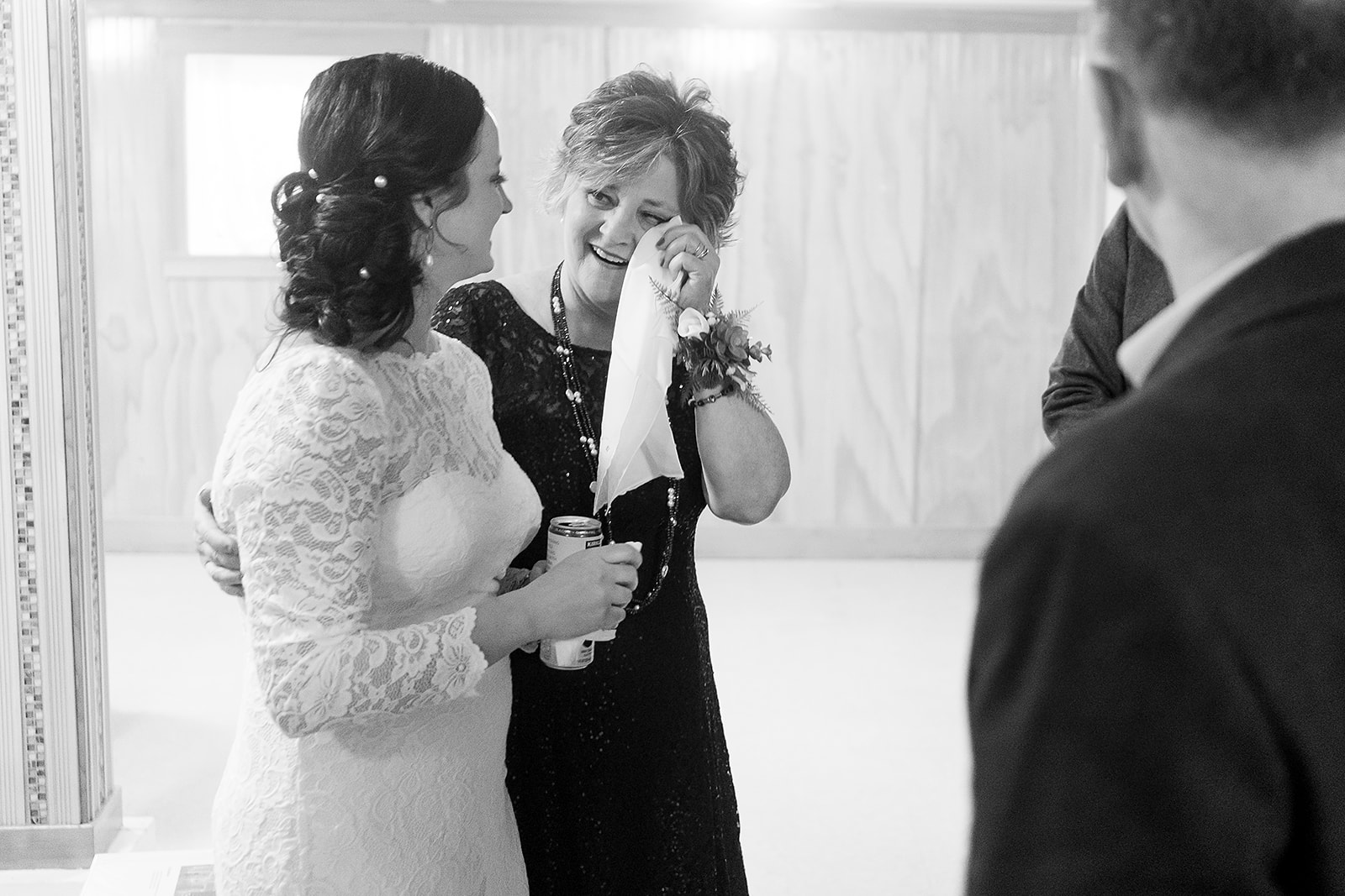 brides mom wipes away a tear before wedding ceremony at port gamble wedding