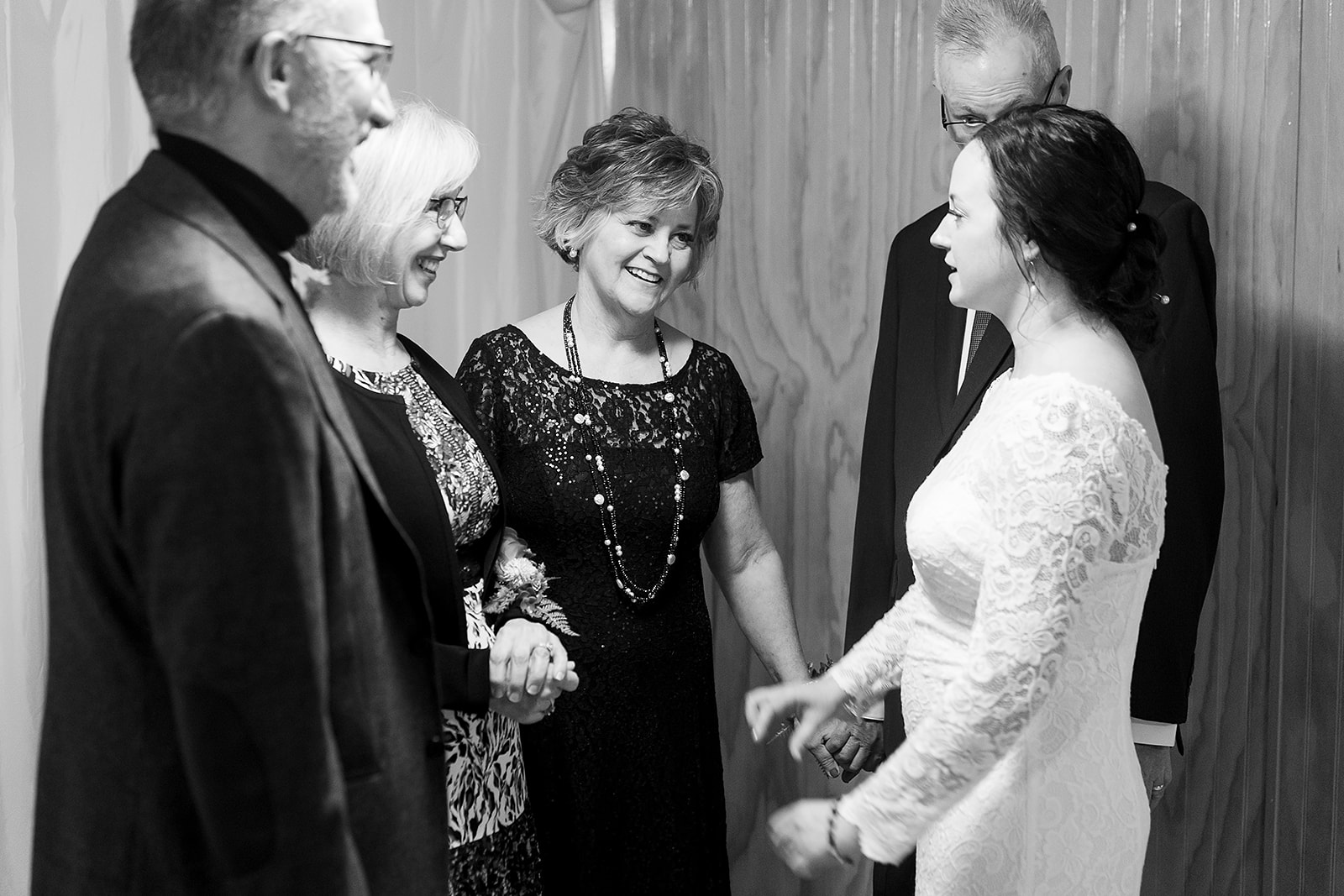 family embrace together before wedding ceremony at port gamble