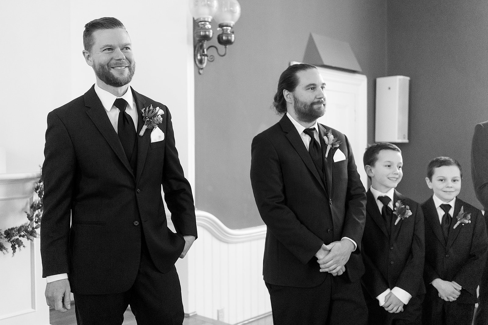 groom smiles when he sees bride walking down the aisle