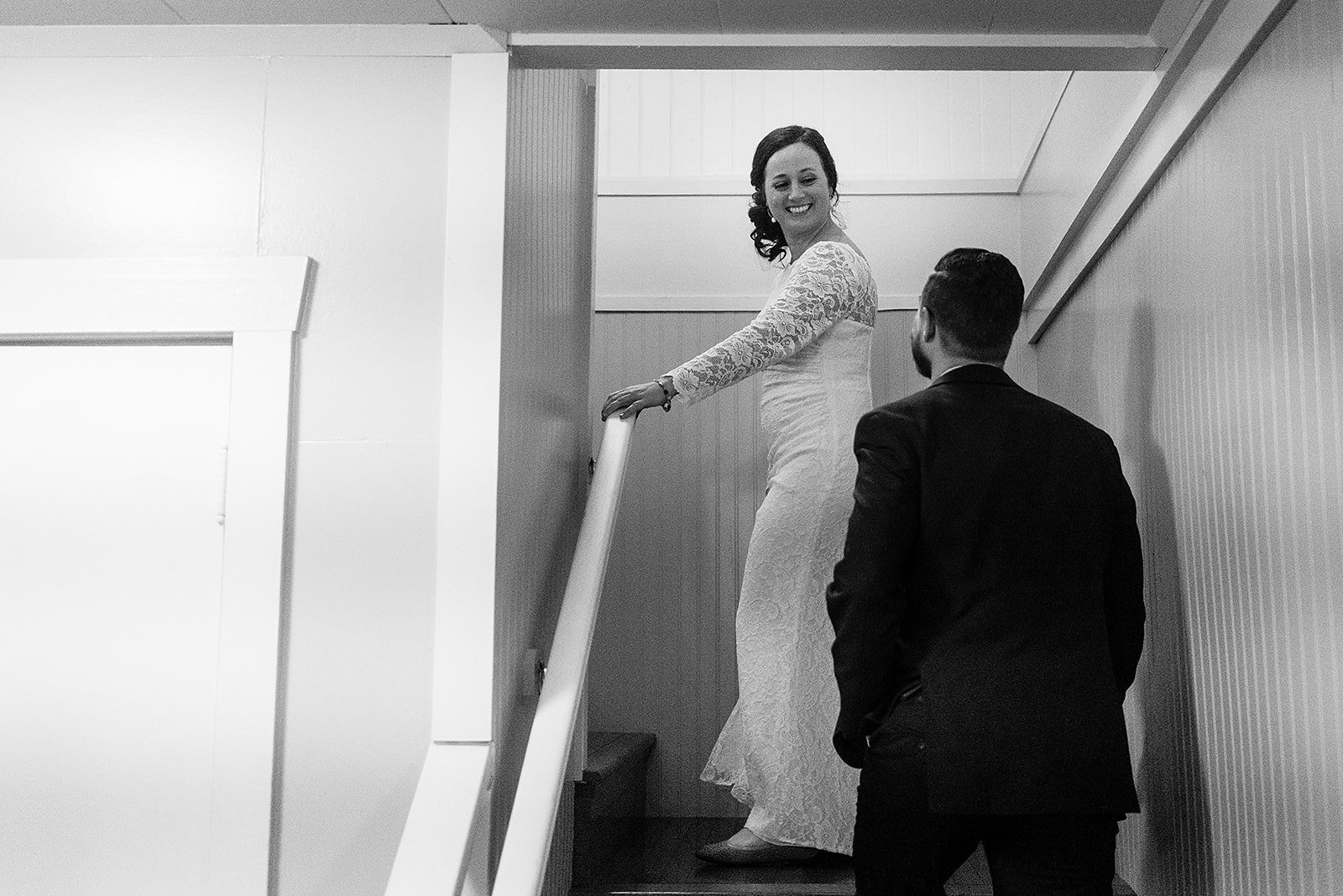 bride and groom walk upstairs after port gamble wedding 