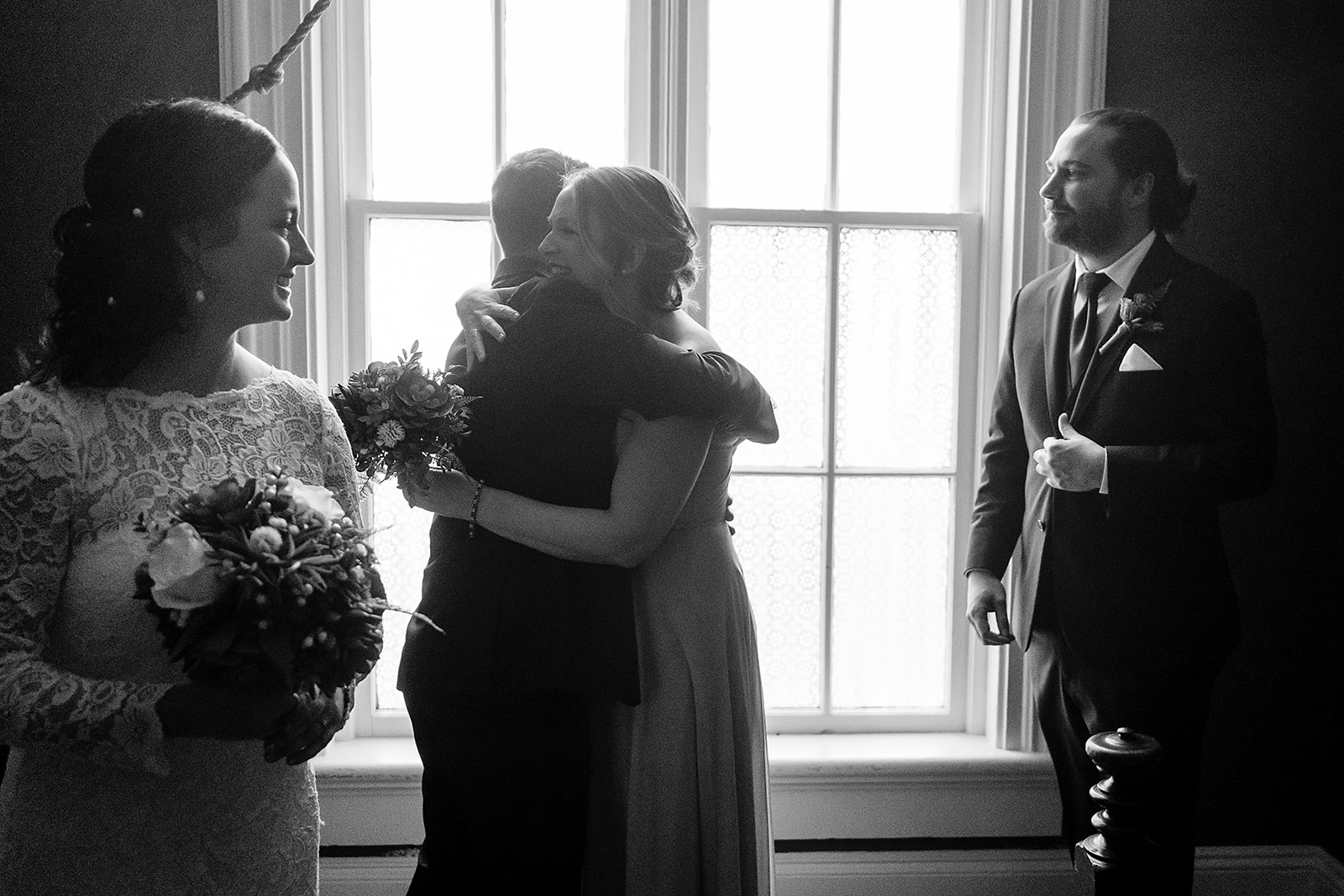 family embraces after port gamble wedding ceremony