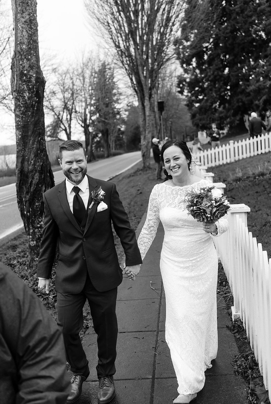 bride and groom walk to wedding reception in port gamble