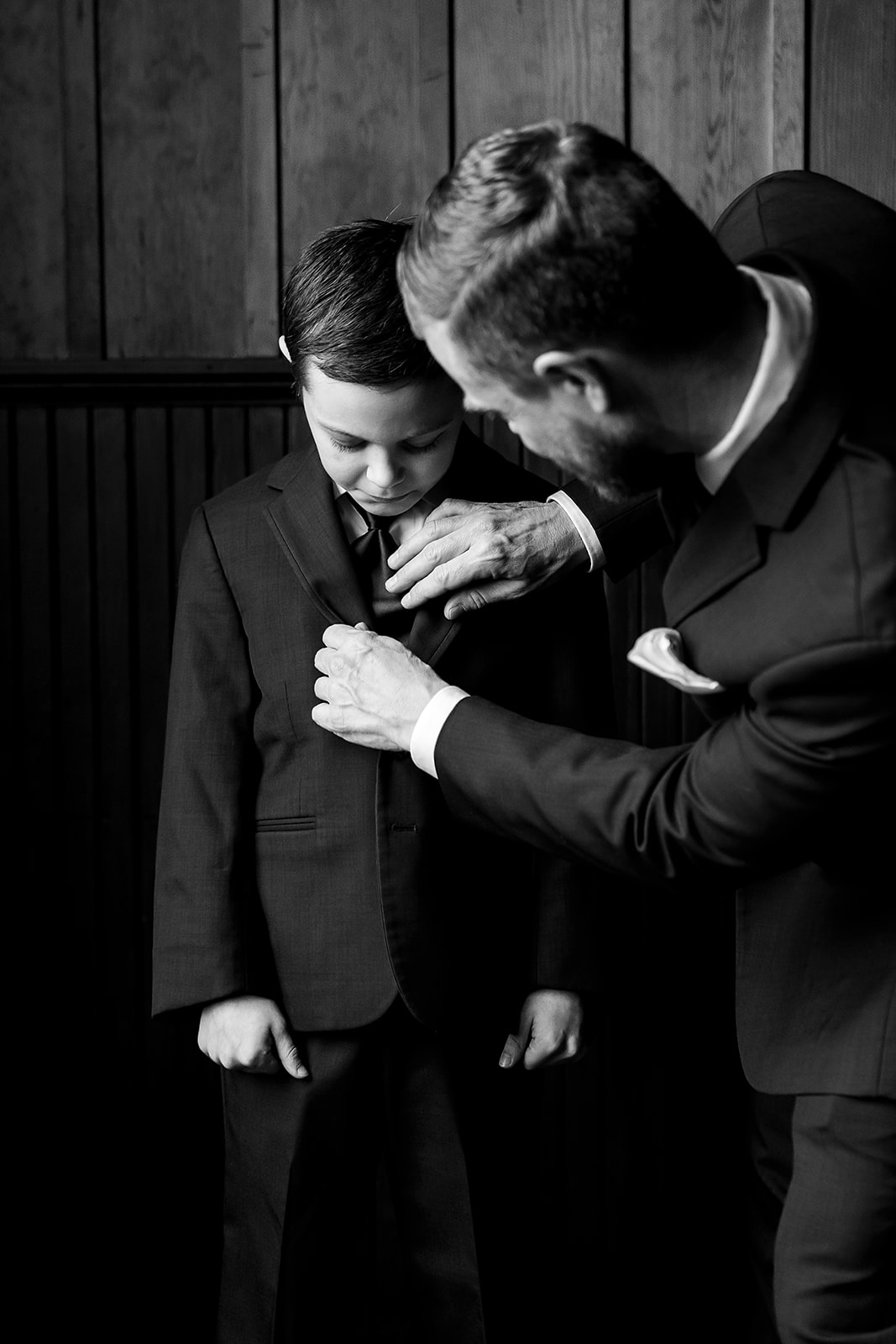 groom helps groomsmen get ties on at port gamble wedding