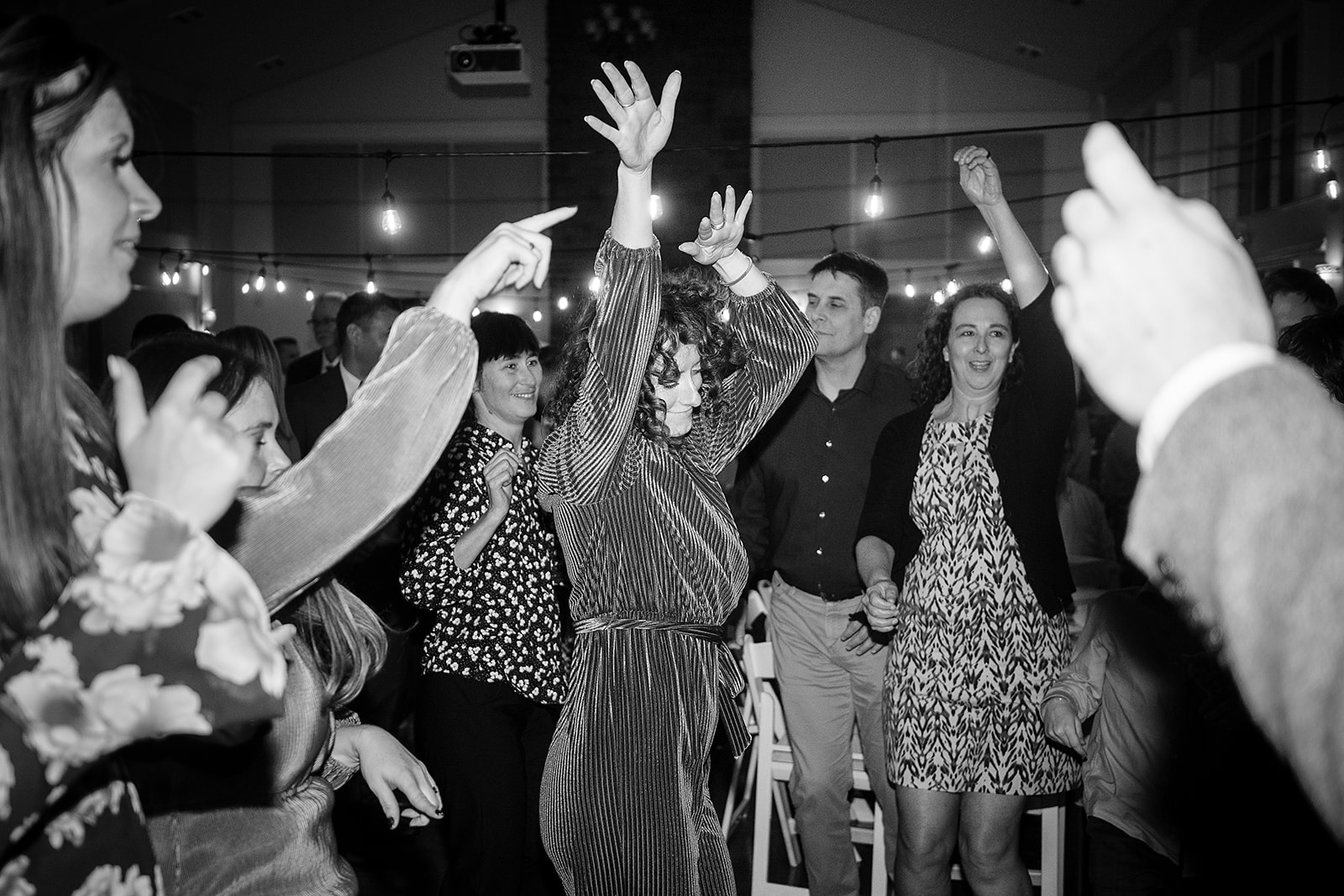 wedding guests dance at port gamble wedding reception