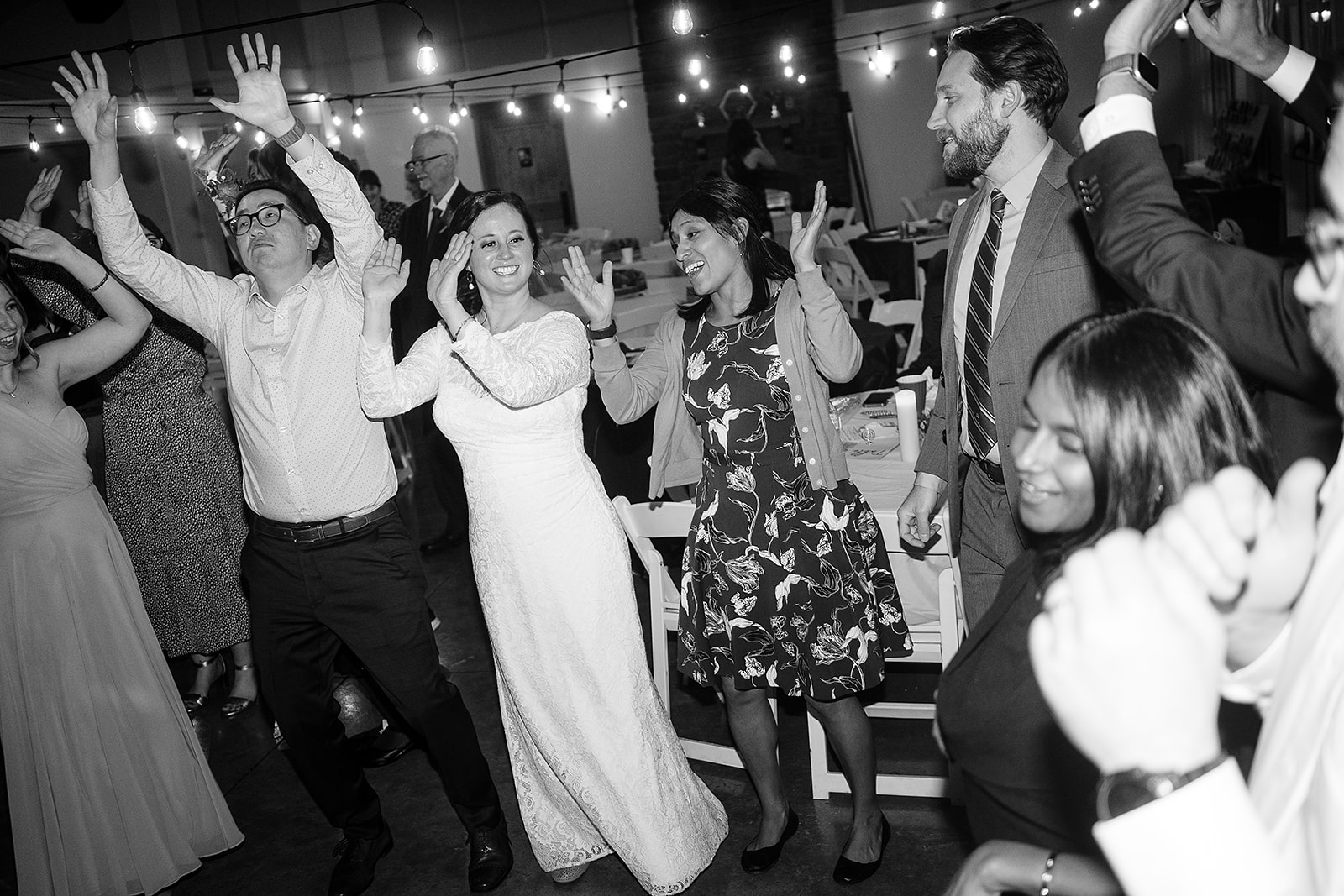 bride dances with friends at port gamble wedding reception