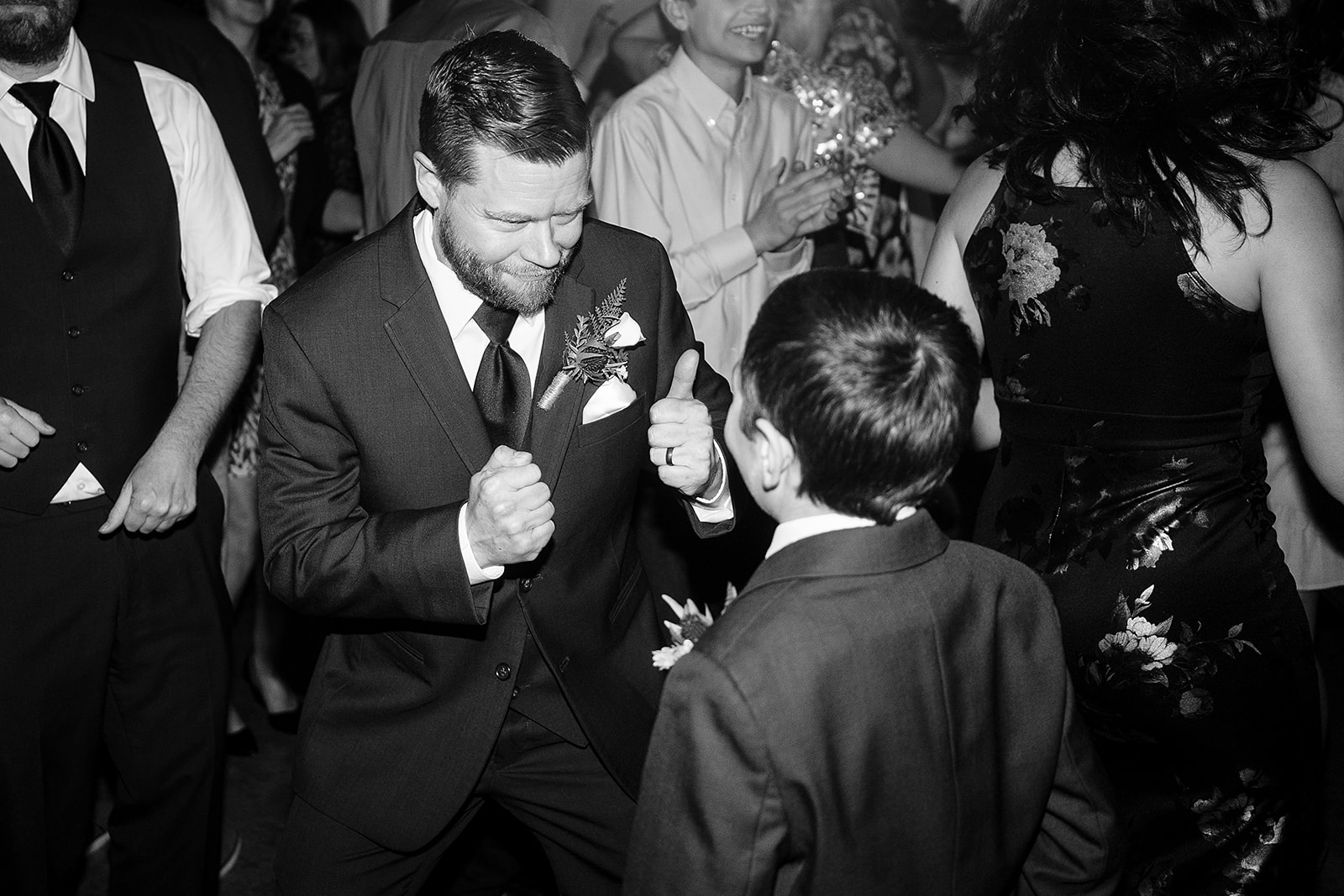 groom dances with son at port gamble wedding reception