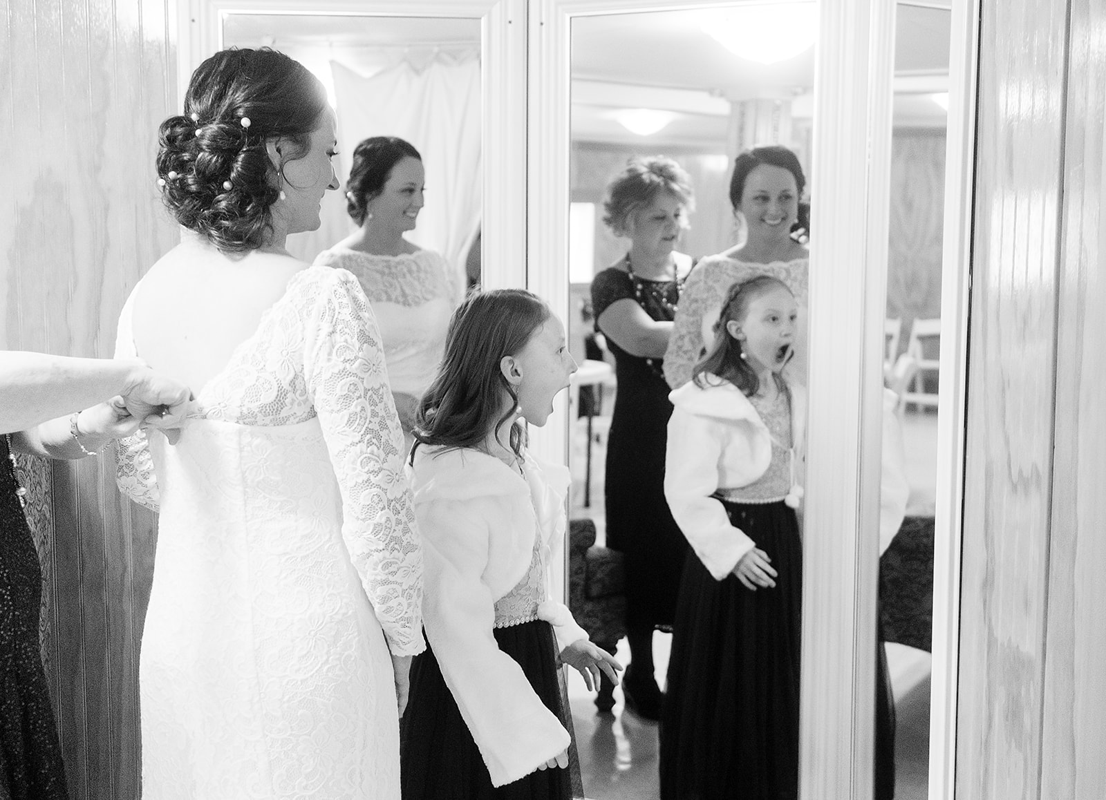 flower girl reacts to bride in dress at port gamble wedding