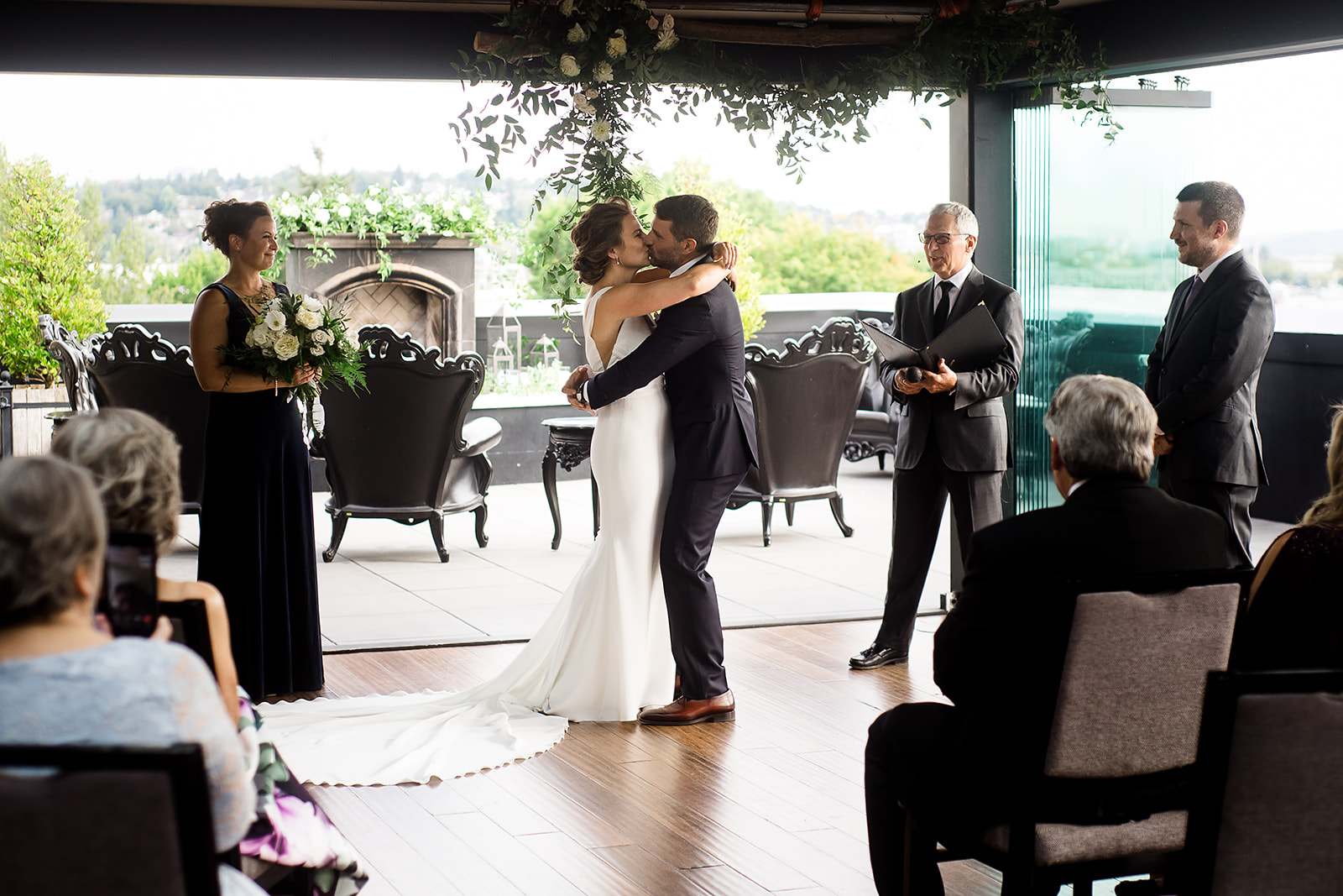 first kiss at Hotel Ballard Olympic Rooftop Pavilion Wedding