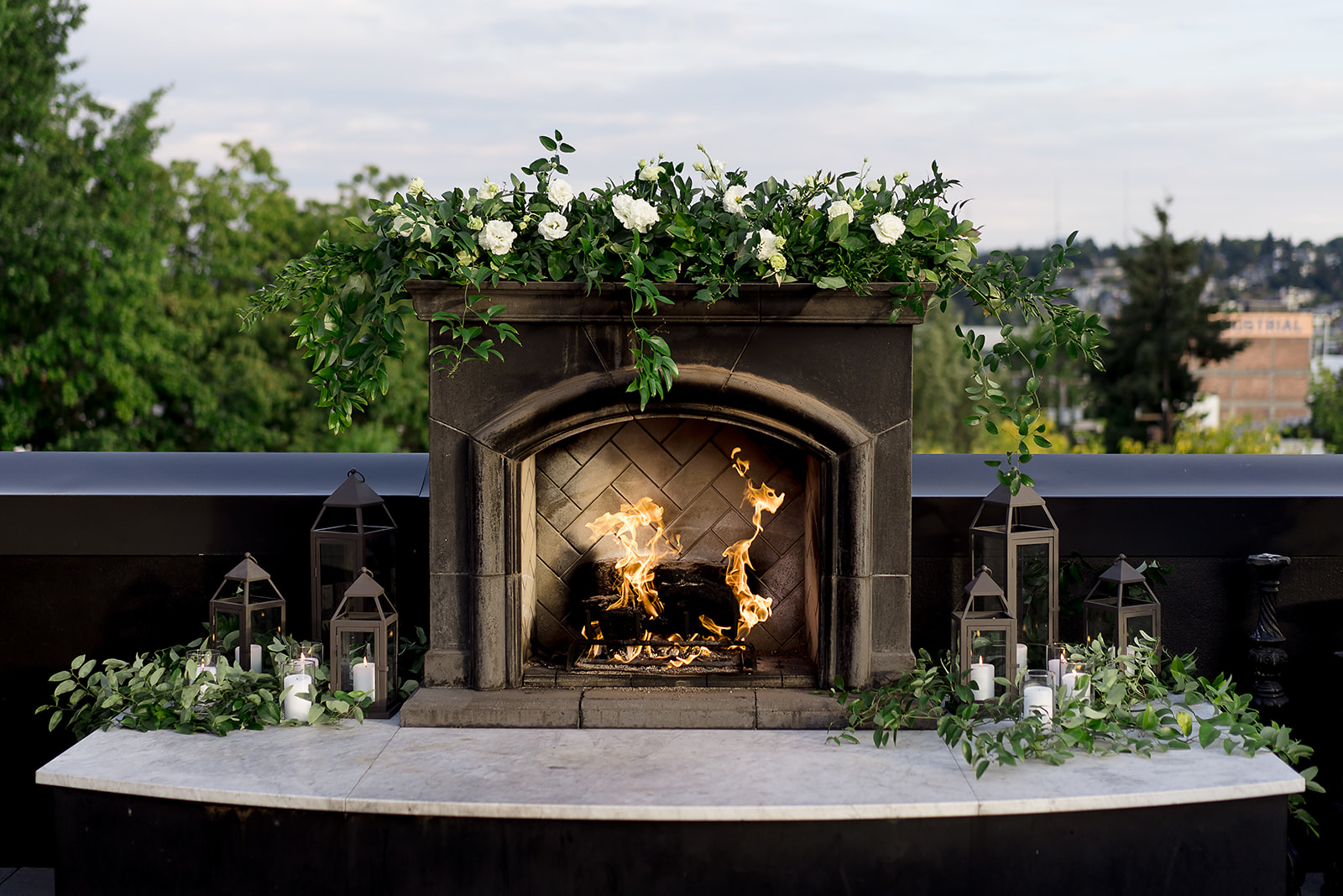 Olympic Rooftop Pavilion fireplace with florals