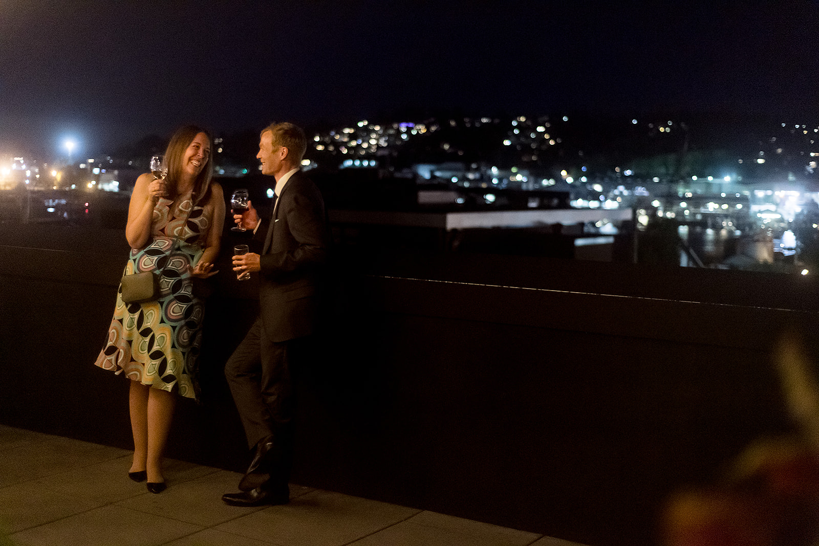 wedding guests enjoy the roof top at Olympic Rooftop Pavilion Wedding 