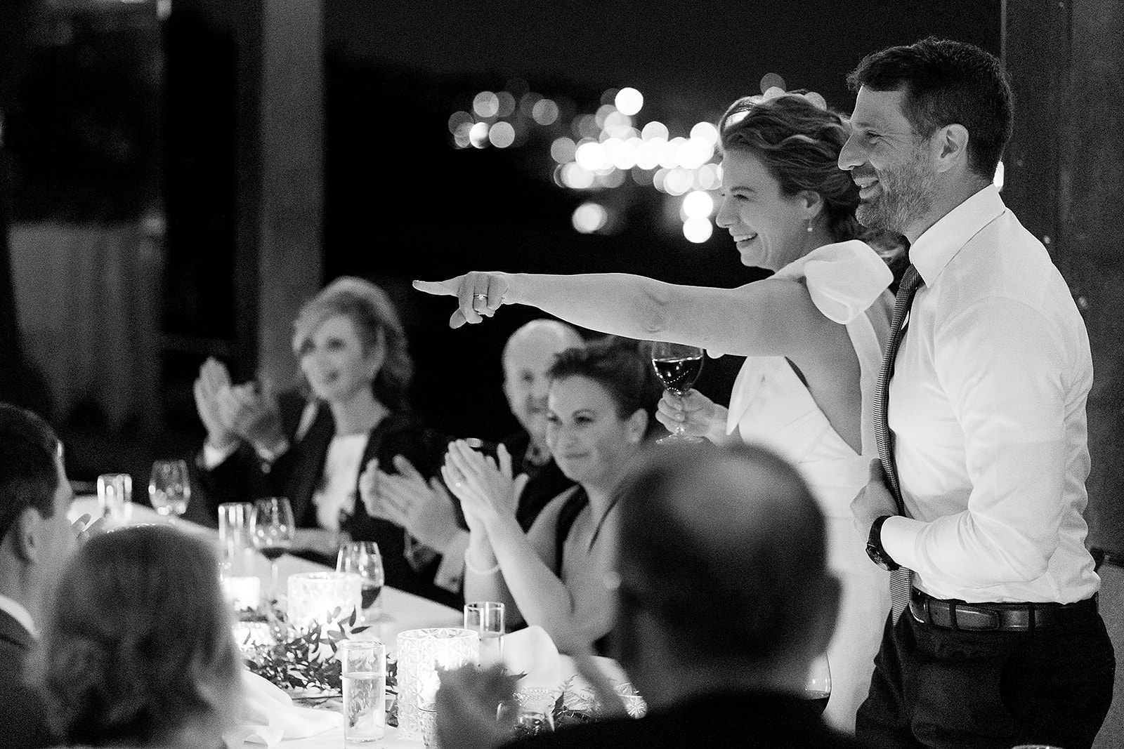 bride and groom give toast after dark at bride at Hotel Ballard Olympic Rooftop Pavilion