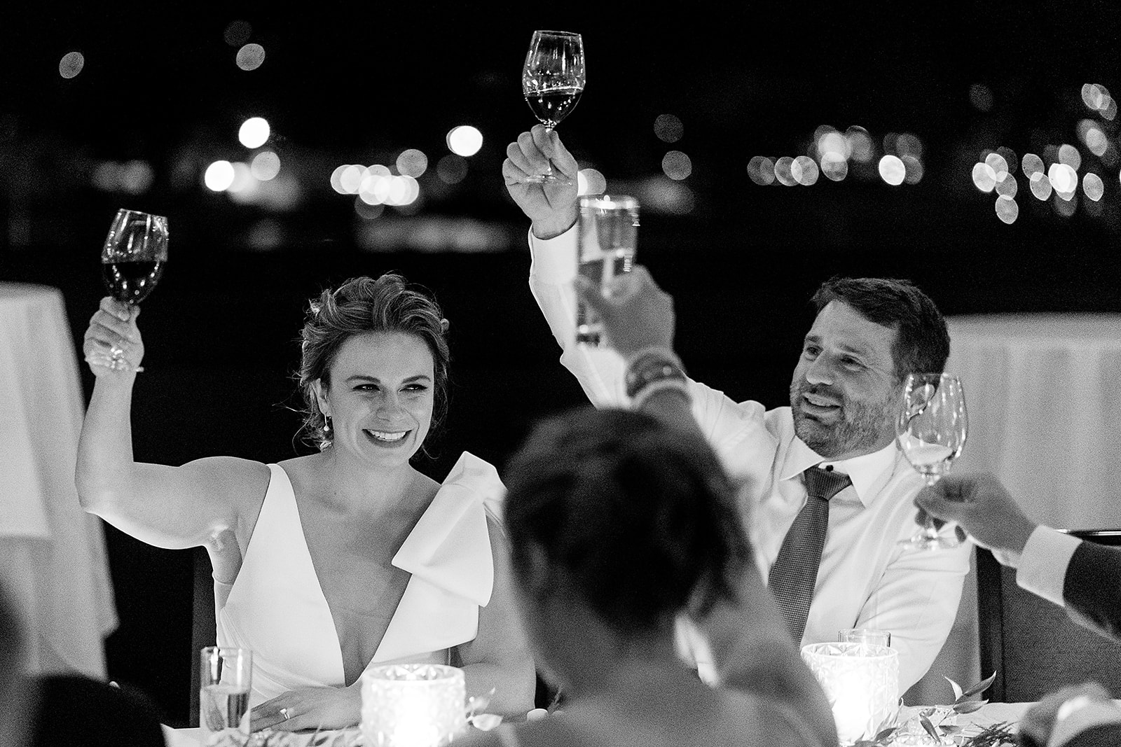 bride and groom raise their glass for wedding toast at Olympic Rooftop Pavilion Wedding reception