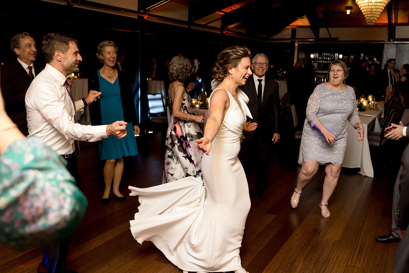 bride and groom enter the dance floor at at Olympic Rooftop Pavilion Wedding 