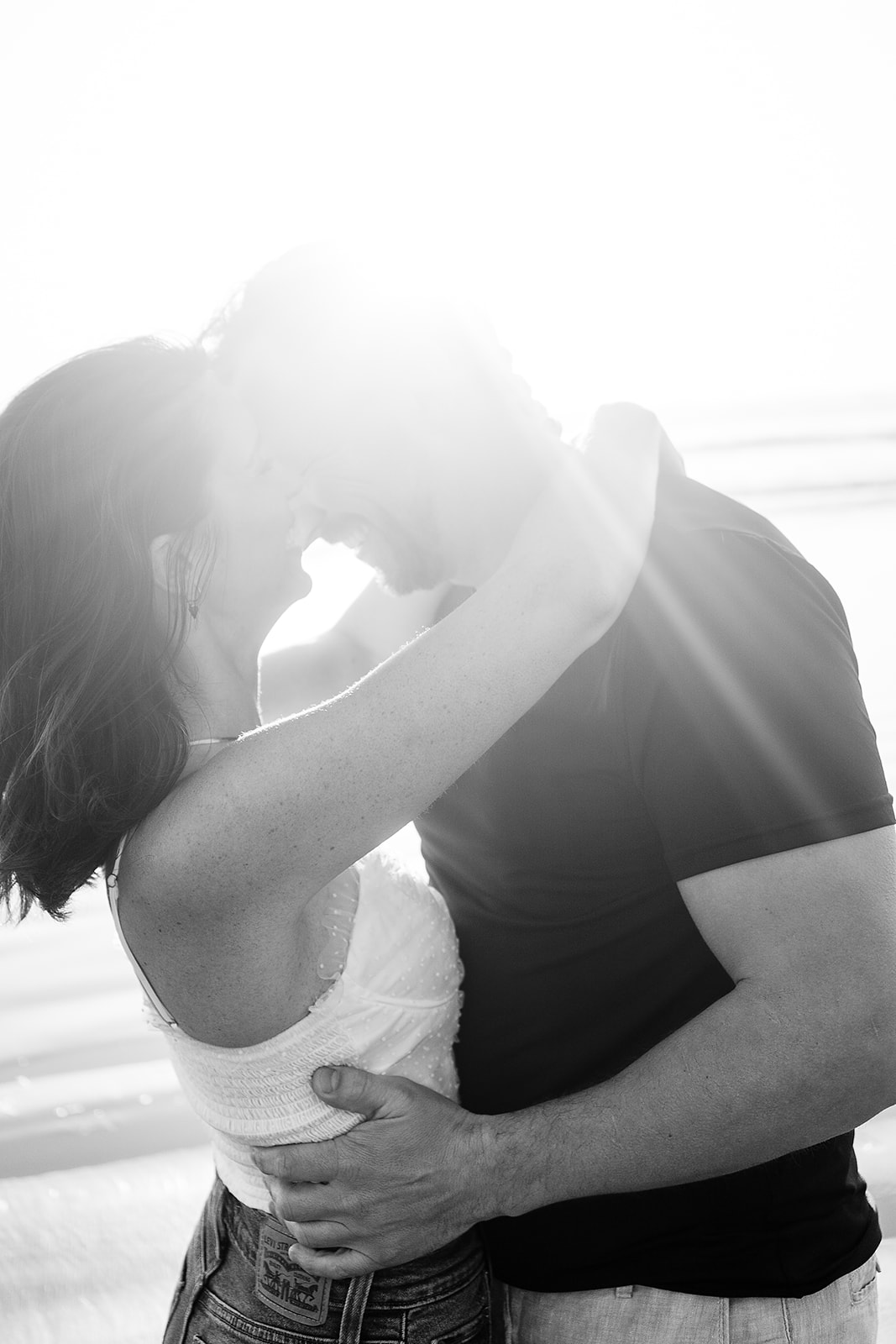 couple has intimate moment on the beach at Cannon Beach Engagement session