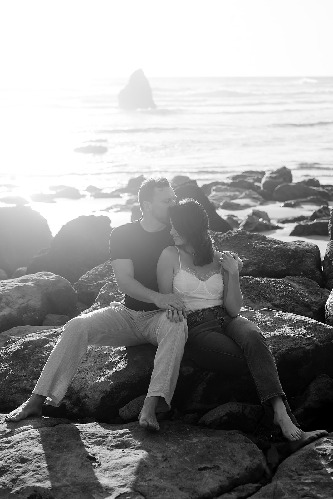 couple poses for a quiet moment during their Cannon Beach Engagement session