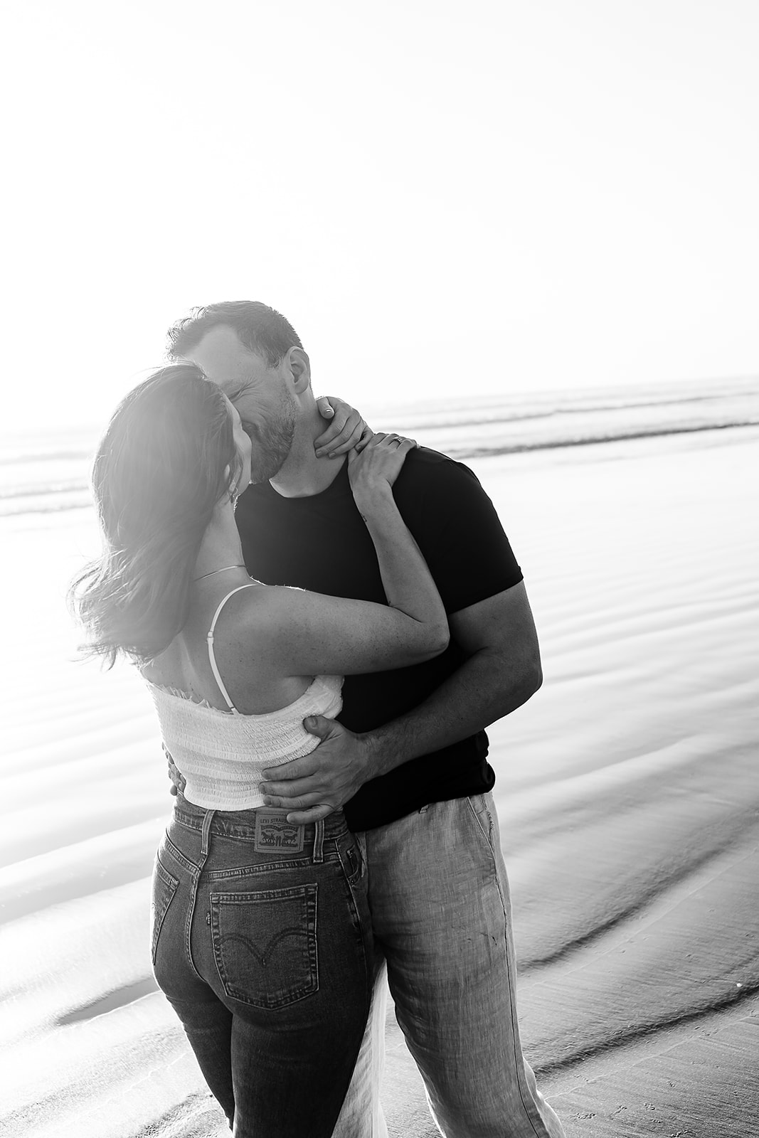 couples kisses at Cannon Beach during couples portrait session