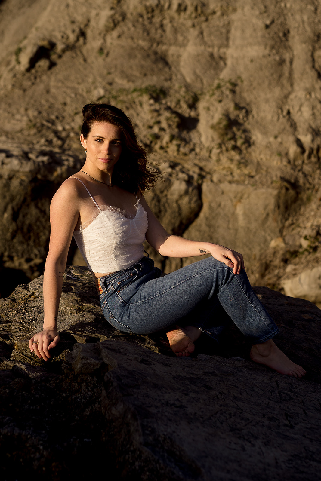 female portrait on beach rocks at Cannon Beach