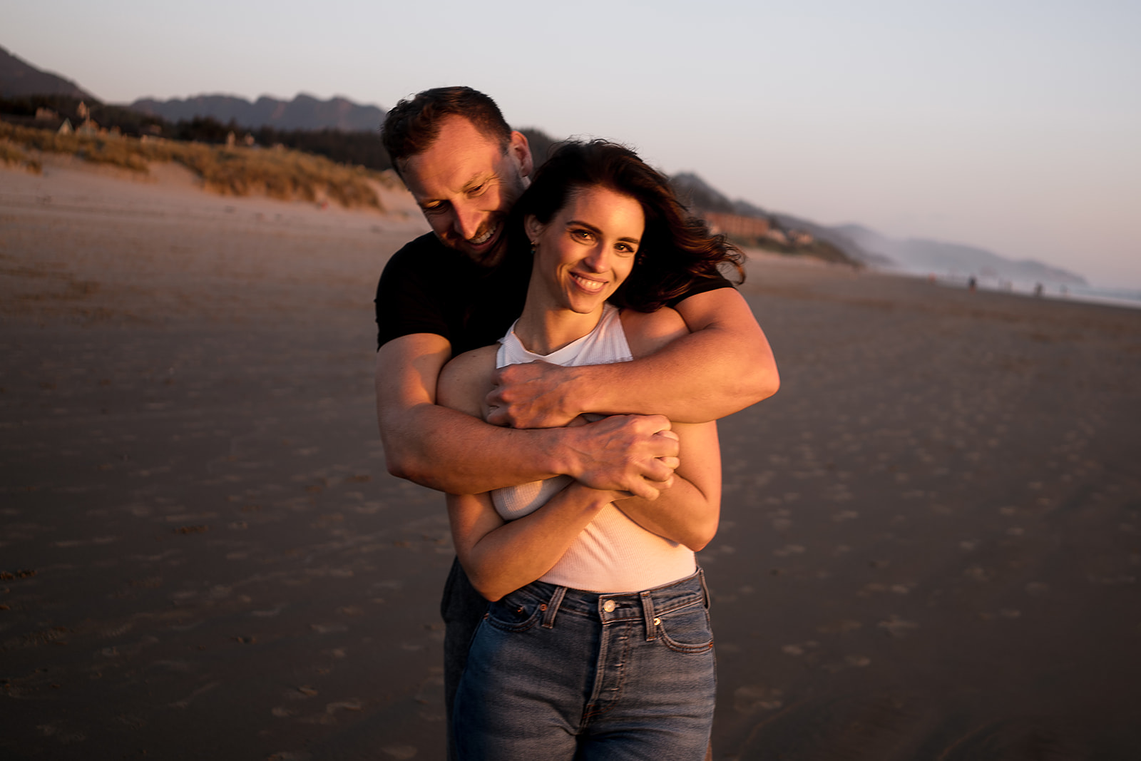Cannon Beach Engagement session were the couple embraces with each other