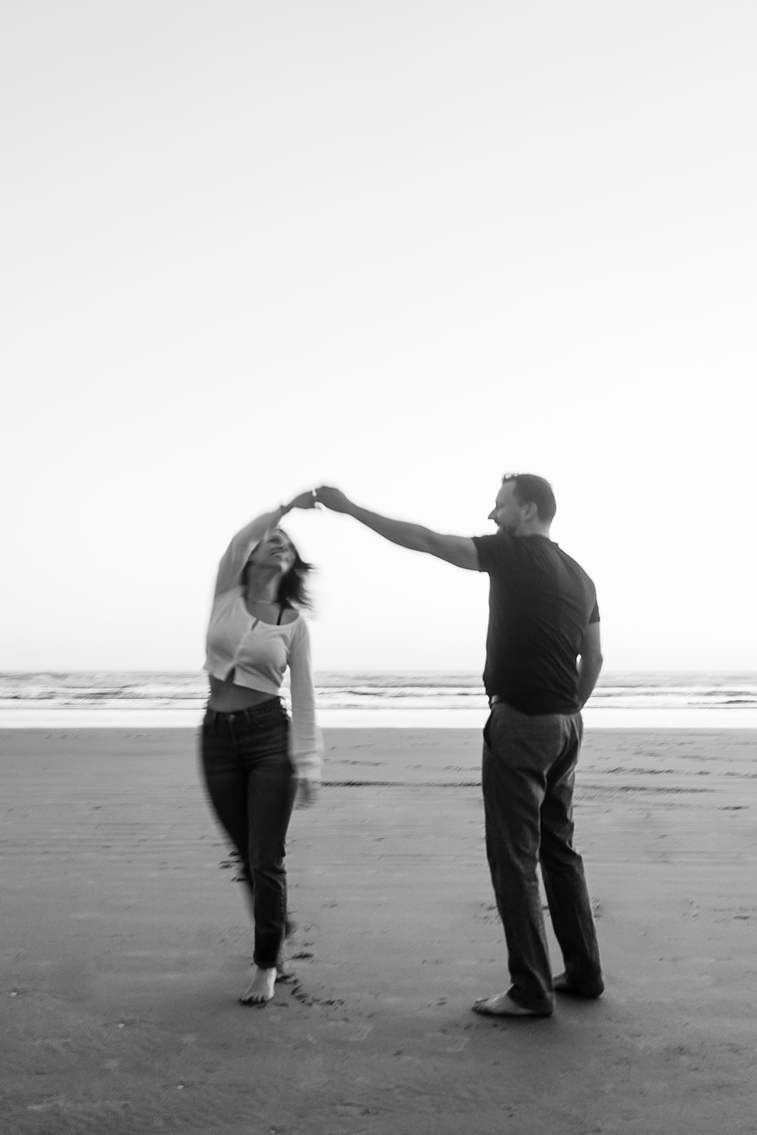 couple dance on the beach during Cannon beach couples portrait session