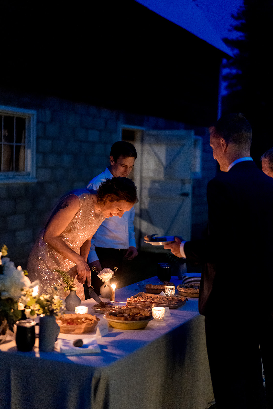 guests serve dessert at Mazama Ranch House Wedding reception