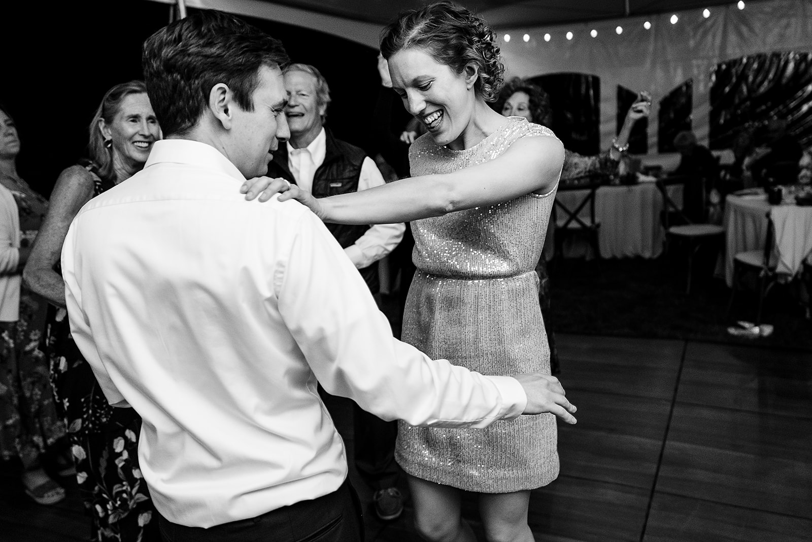 wedding guests dance together at Mazama Ranch House Wedding reception