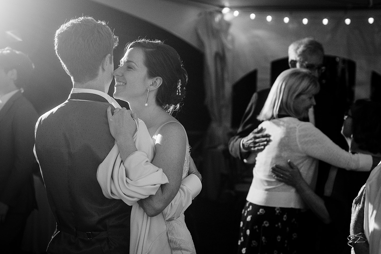 bride and groom snuggle together on dance floor at Mazama Ranch House Wedding reception