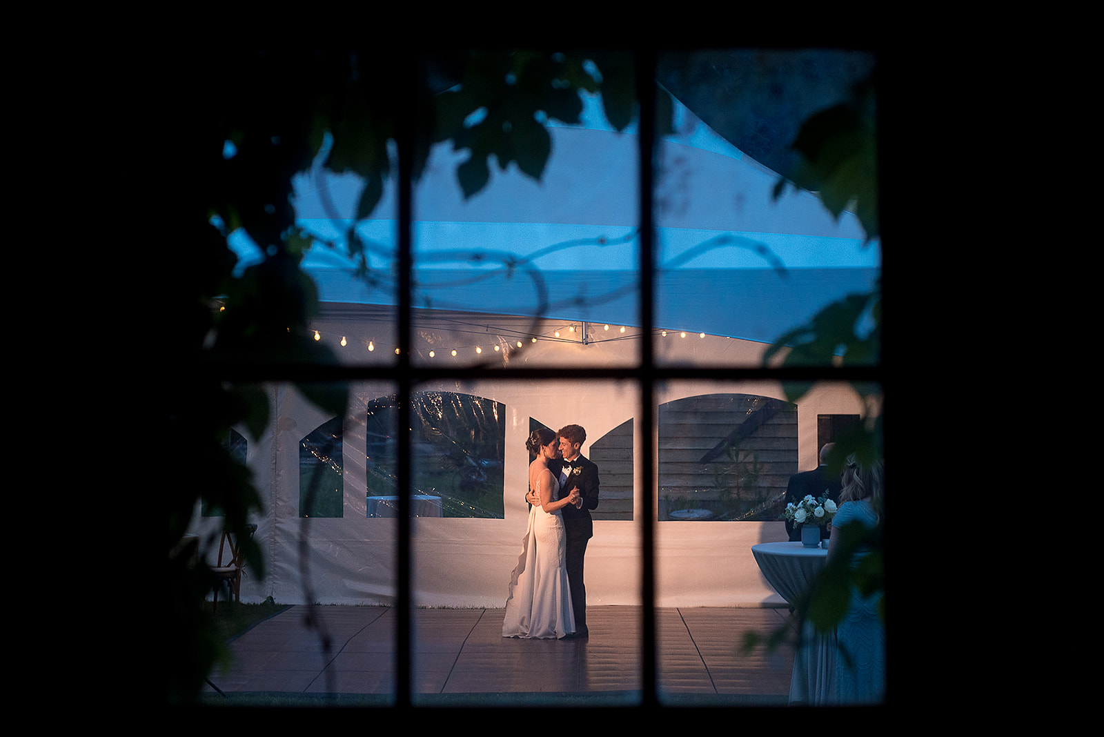 Mazama Ranch House Wedding first dance photographed through barn window