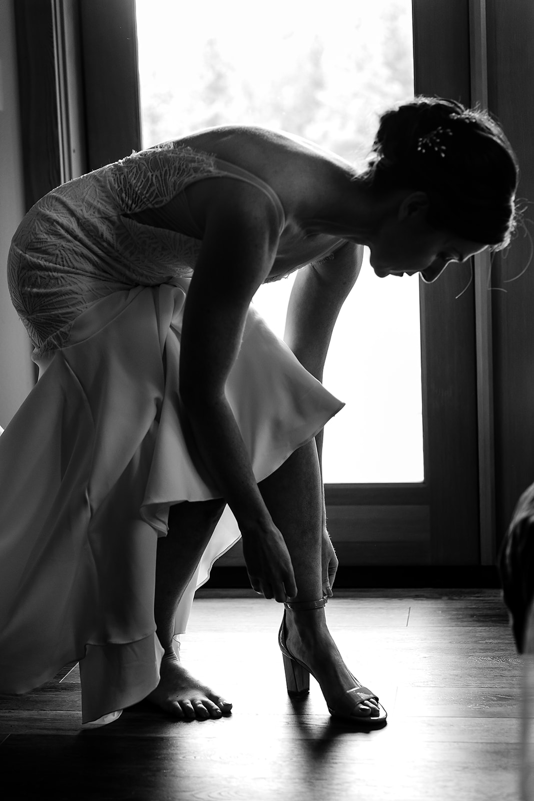 bride puts on aerosoles wedding shoe in Manama