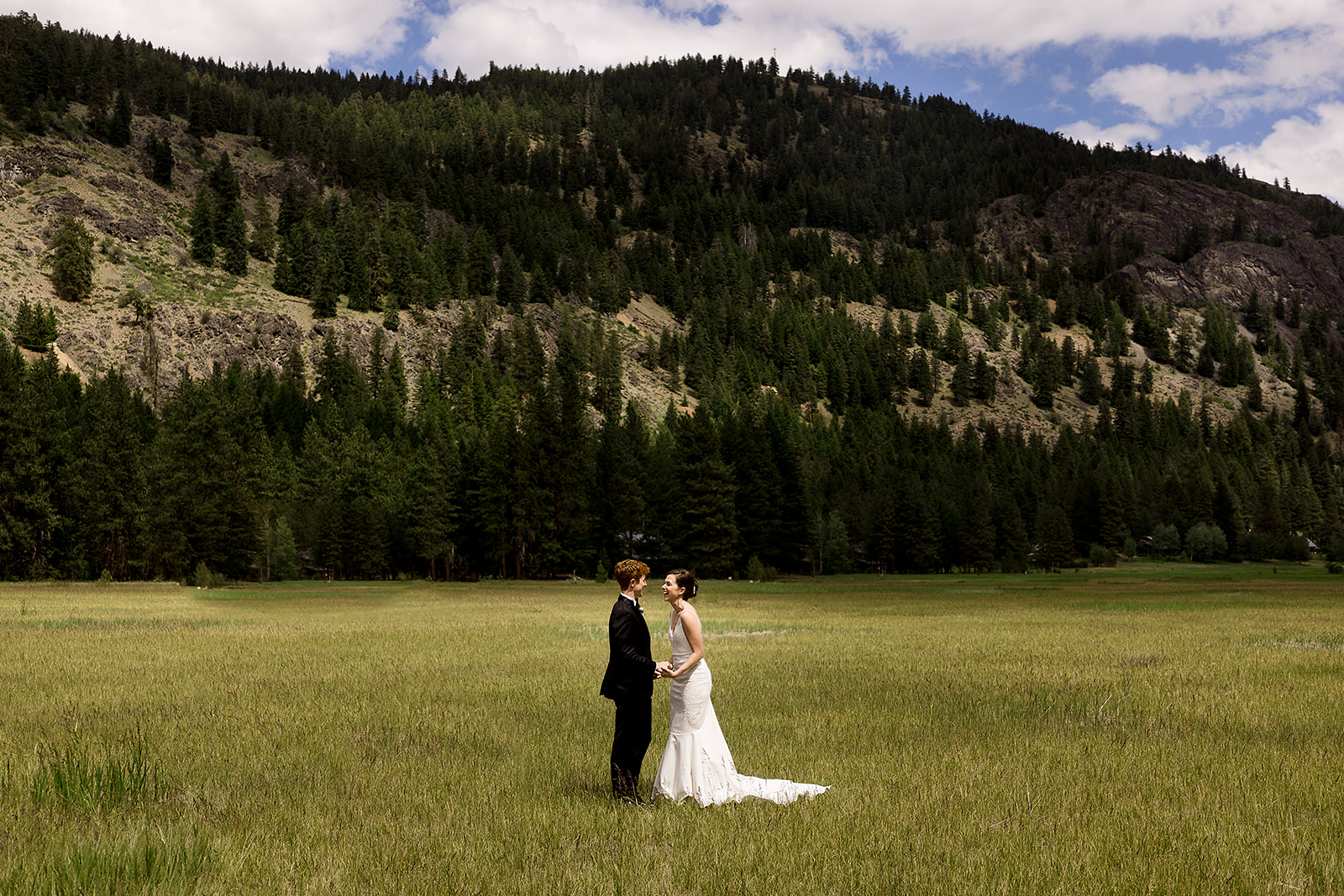 bride and groom first look in the methow valley surrounded by mountains