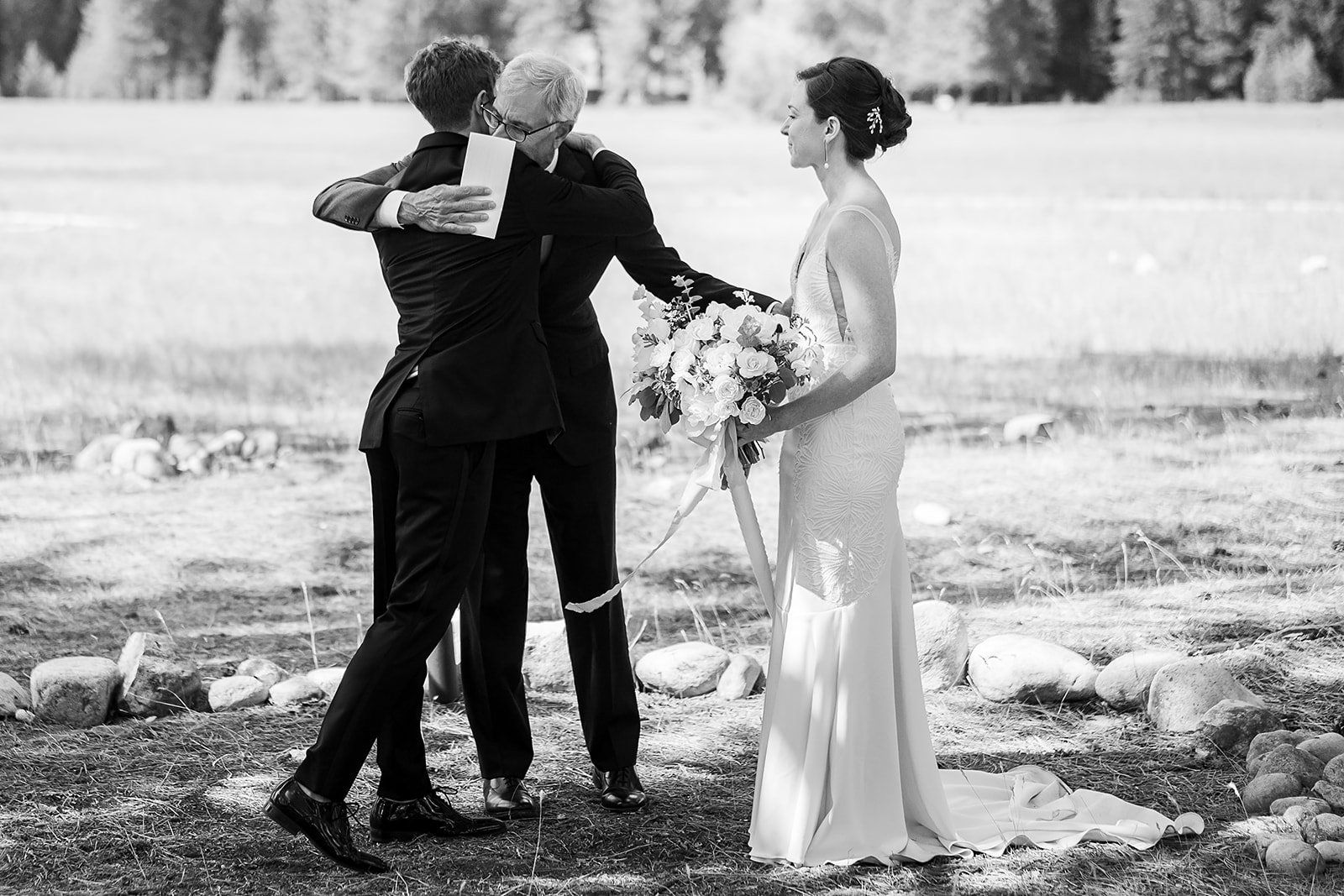 wedding guests hugs the bride and groom during Mazama Ranch House Wedding ceremony