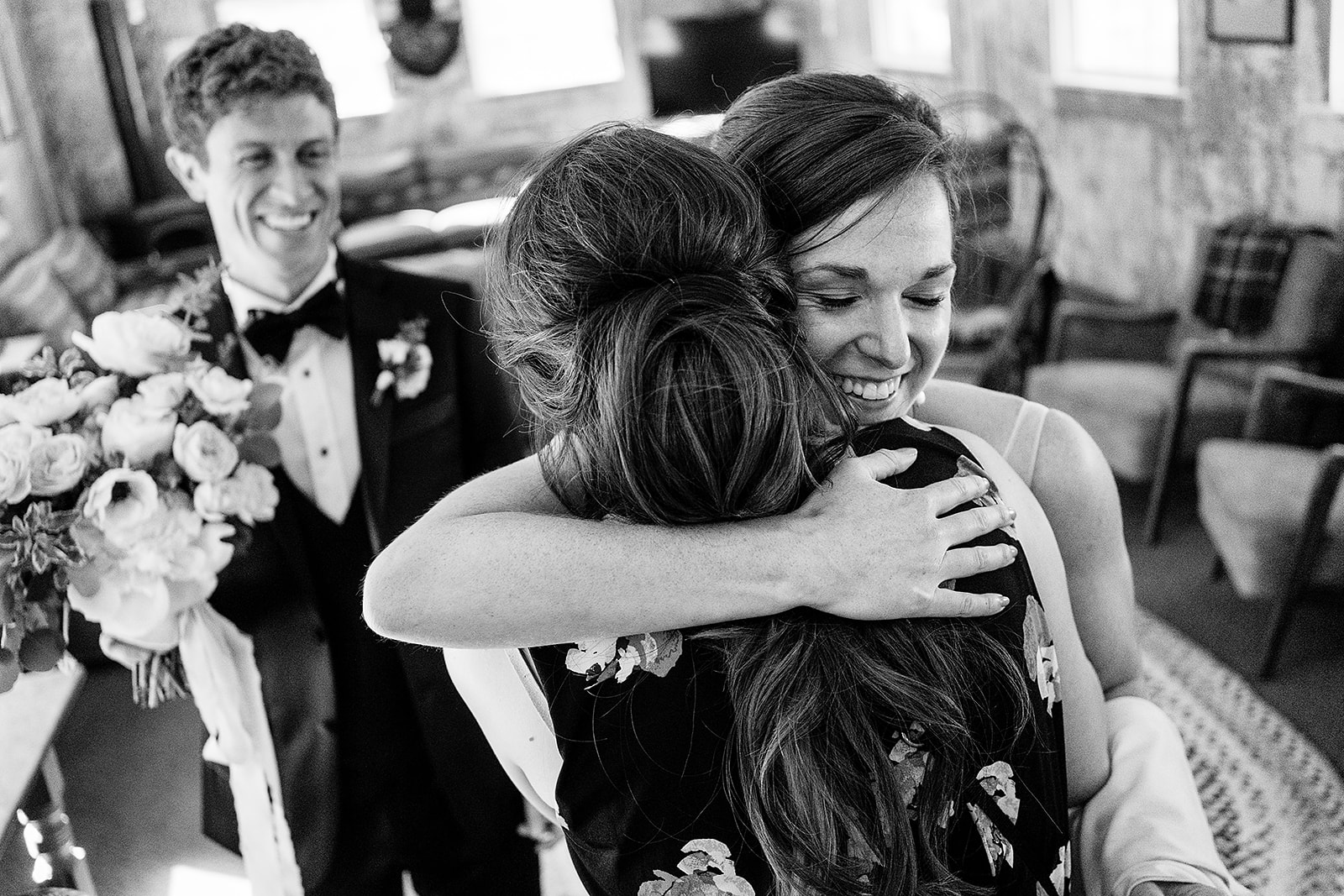 bride embraces friend after Mazama Ranch House Wedding ceremony