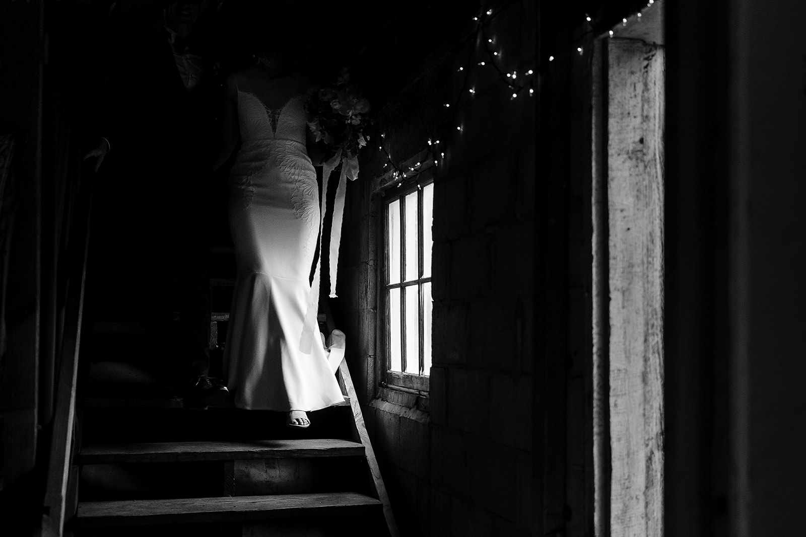 bride walks down barn stairs at Mazama Ranch House Wedding reception