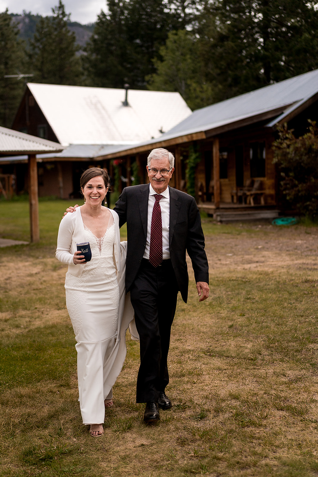 bride and guests walk to Mazama Ranch House Wedding reception