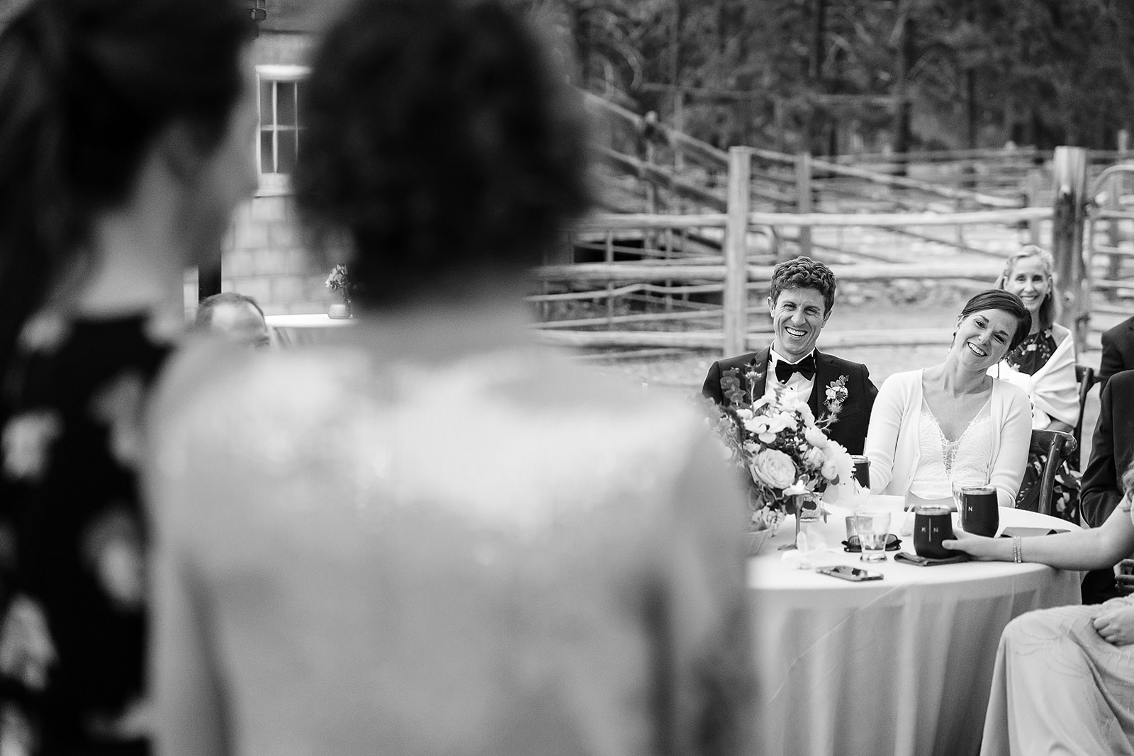 bride and groom laugh during toasts at Mazama Ranch House Wedding reception