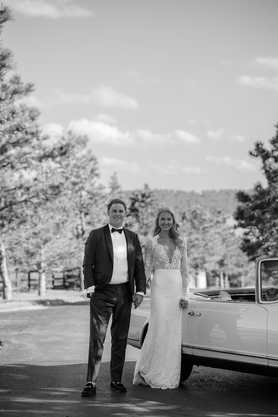Couple with their vintage Mercedes Bez on wedding day at Spruce Mountain Ranch. 