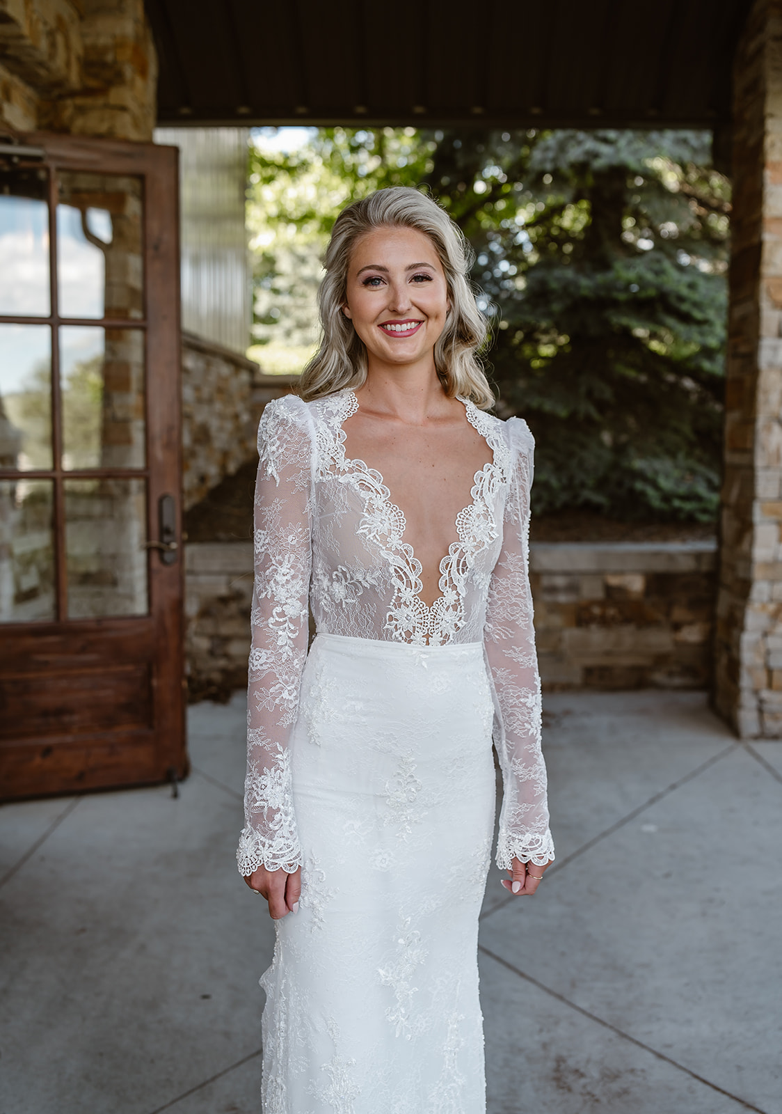 Smiling Bride in wedding dress at Spruce Mountain Ranch.