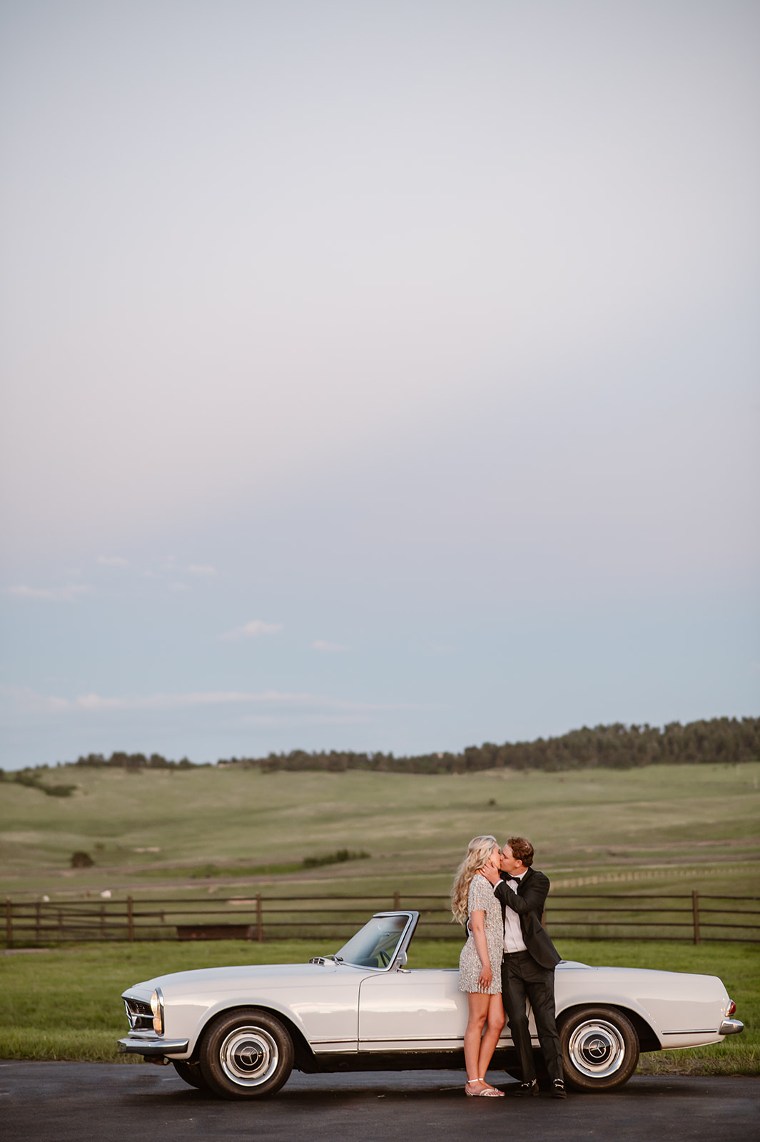 Colorado Wedding Photographer. Couple during their sunset portraits at their wedding reception in Spruce Mountain Ranch