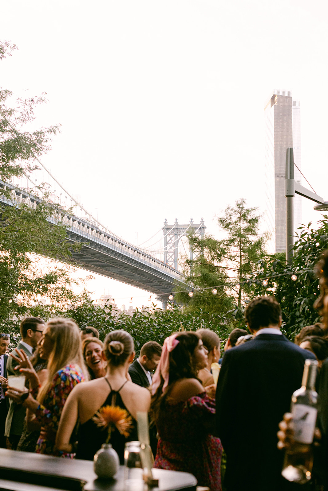 Summery NYC wedding that took place at Celestine just under the Manhattan Bridge in Dumbo, Brooklyn. Shot by Weddings by