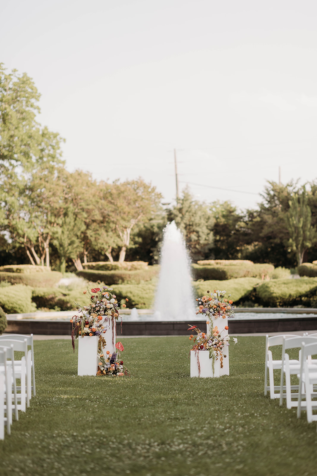 A spring festival style wedding with colorful accents and nostalgic dresses at Texas Discovery Gardens