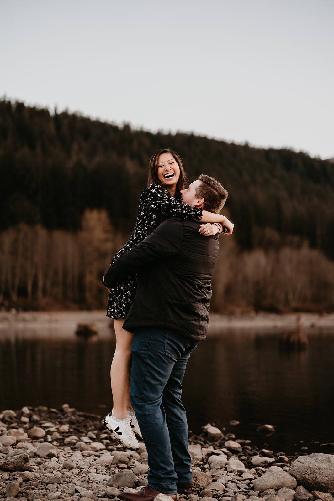 Magical sunset moment shared by the lake during engagement session