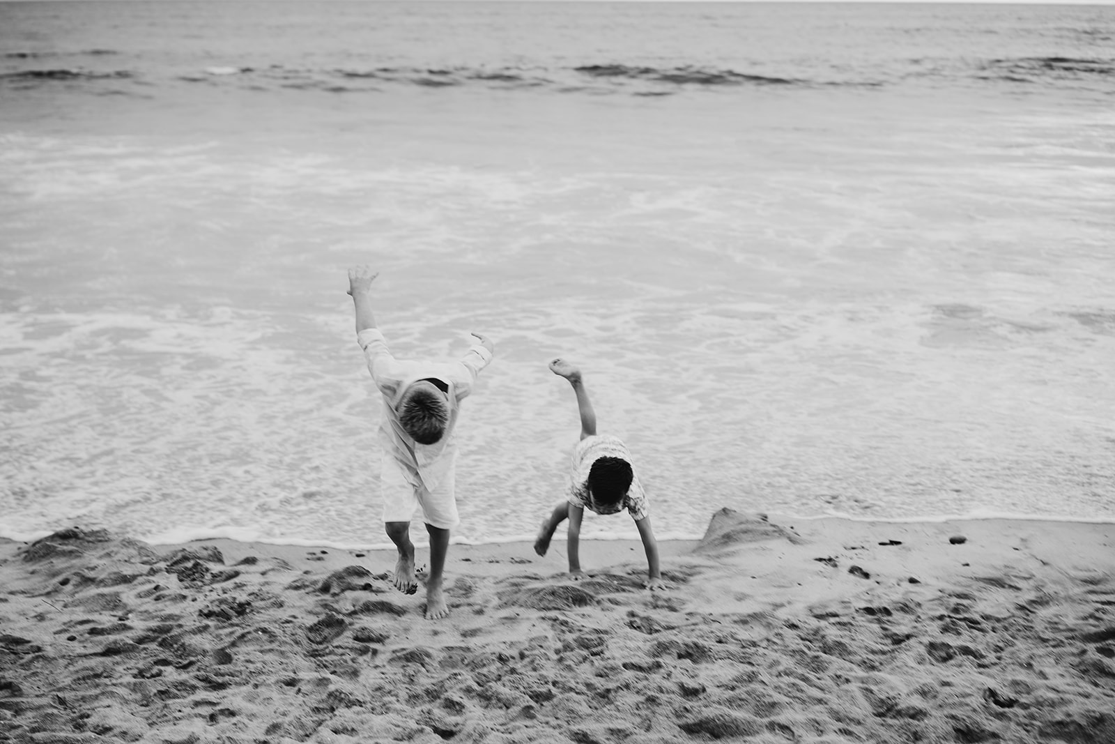 Cousins playing on the beach
