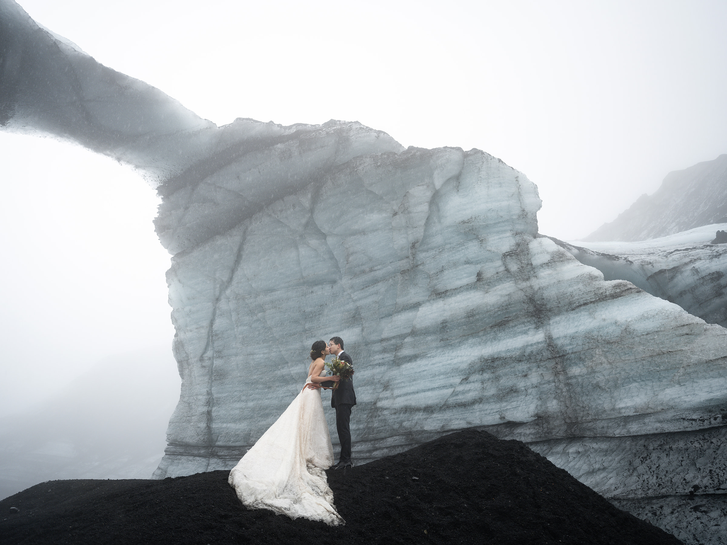 couple eloping in an Ice cave in iceland 