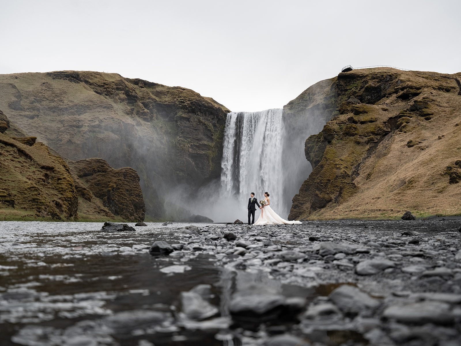 Couple Eloping at Skogafoss waterfall in Iceland.
