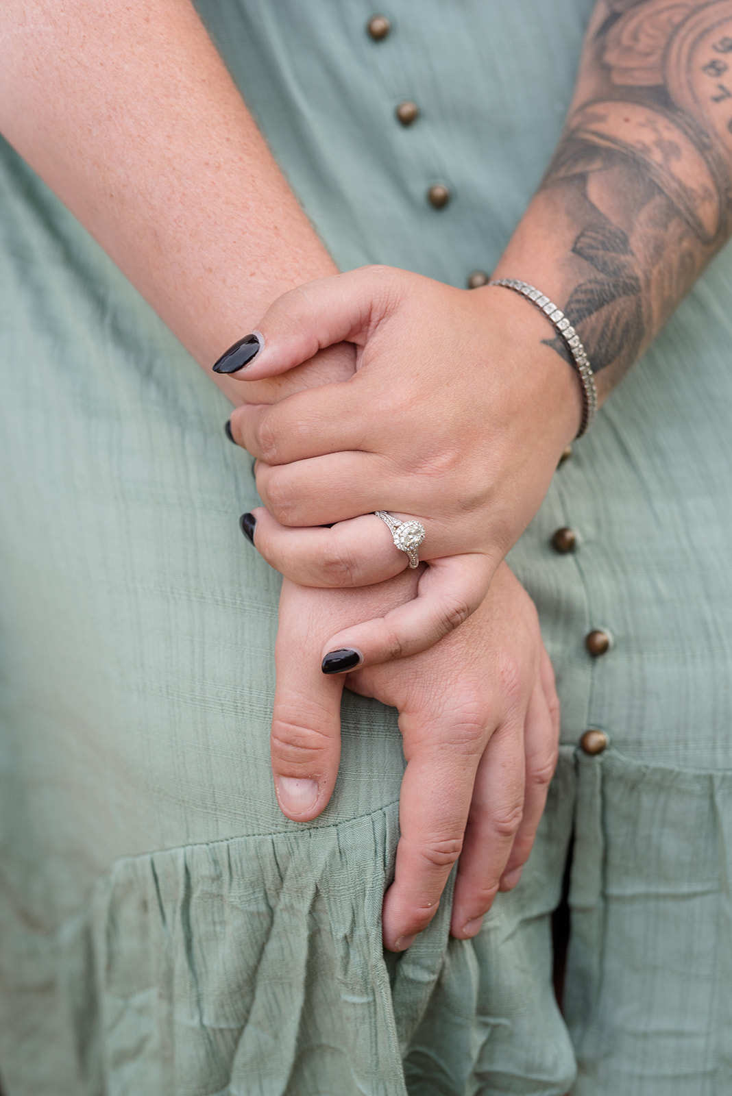 Close up on engaged couple's hands