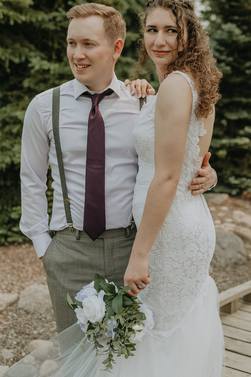 A couple says their vows in an intimate garden wedding in Edmonton, Alberta. 