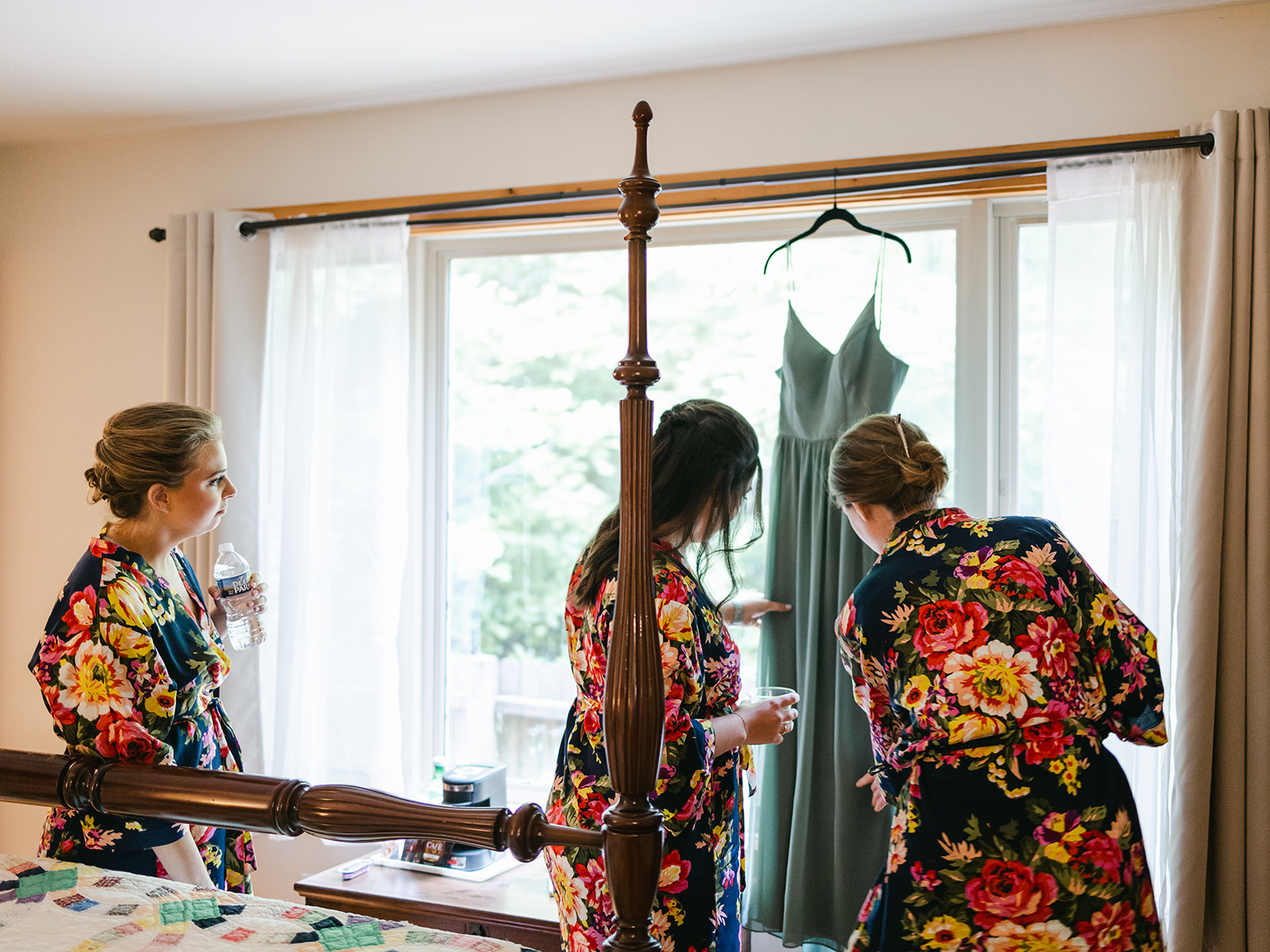 bridesmaids prepare for wedding day infront of window hachland hill