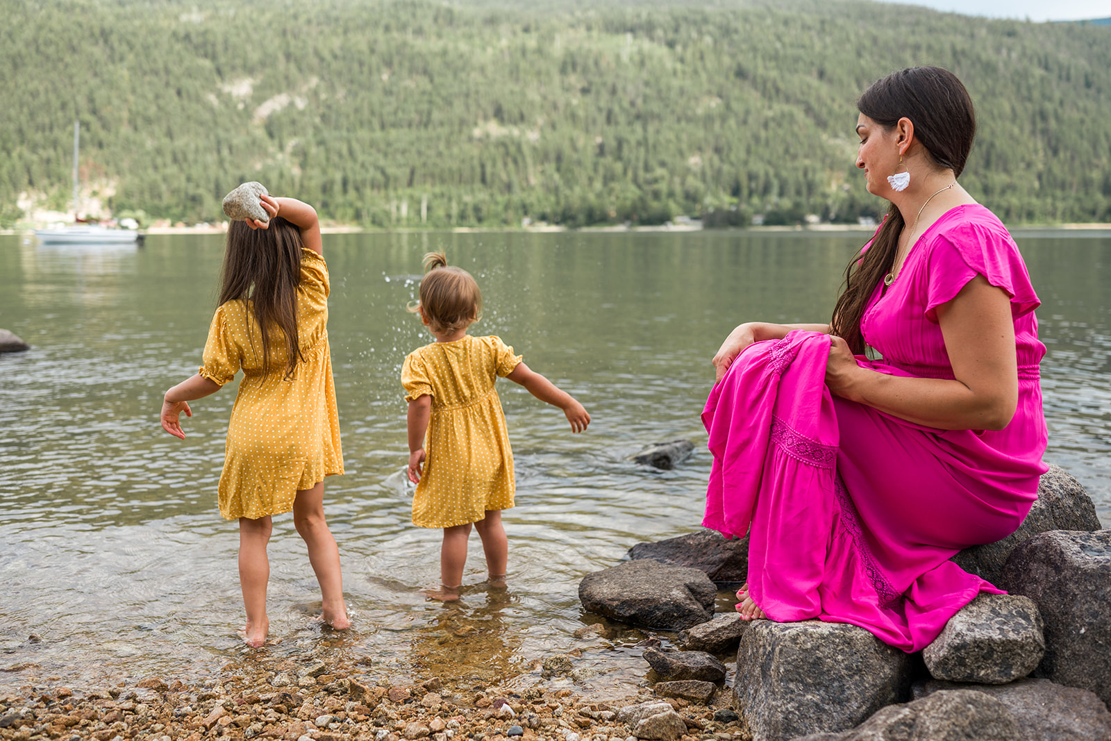 young family plays in the water at Kootenay Lake
