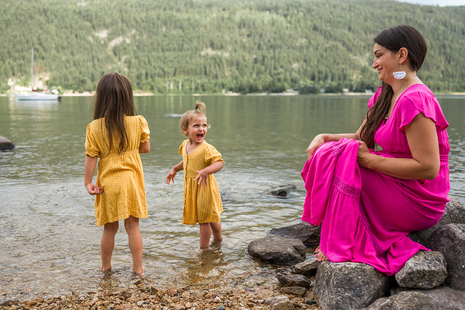 young family plays in the water at Kootenay Lake