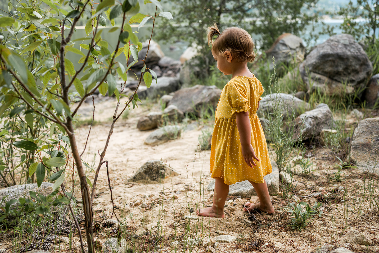 young girl walking towards Kootenay Lake