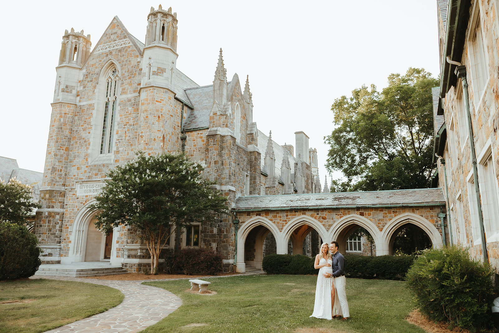 A couple taking maternity photos at Berry College in Rome, GA